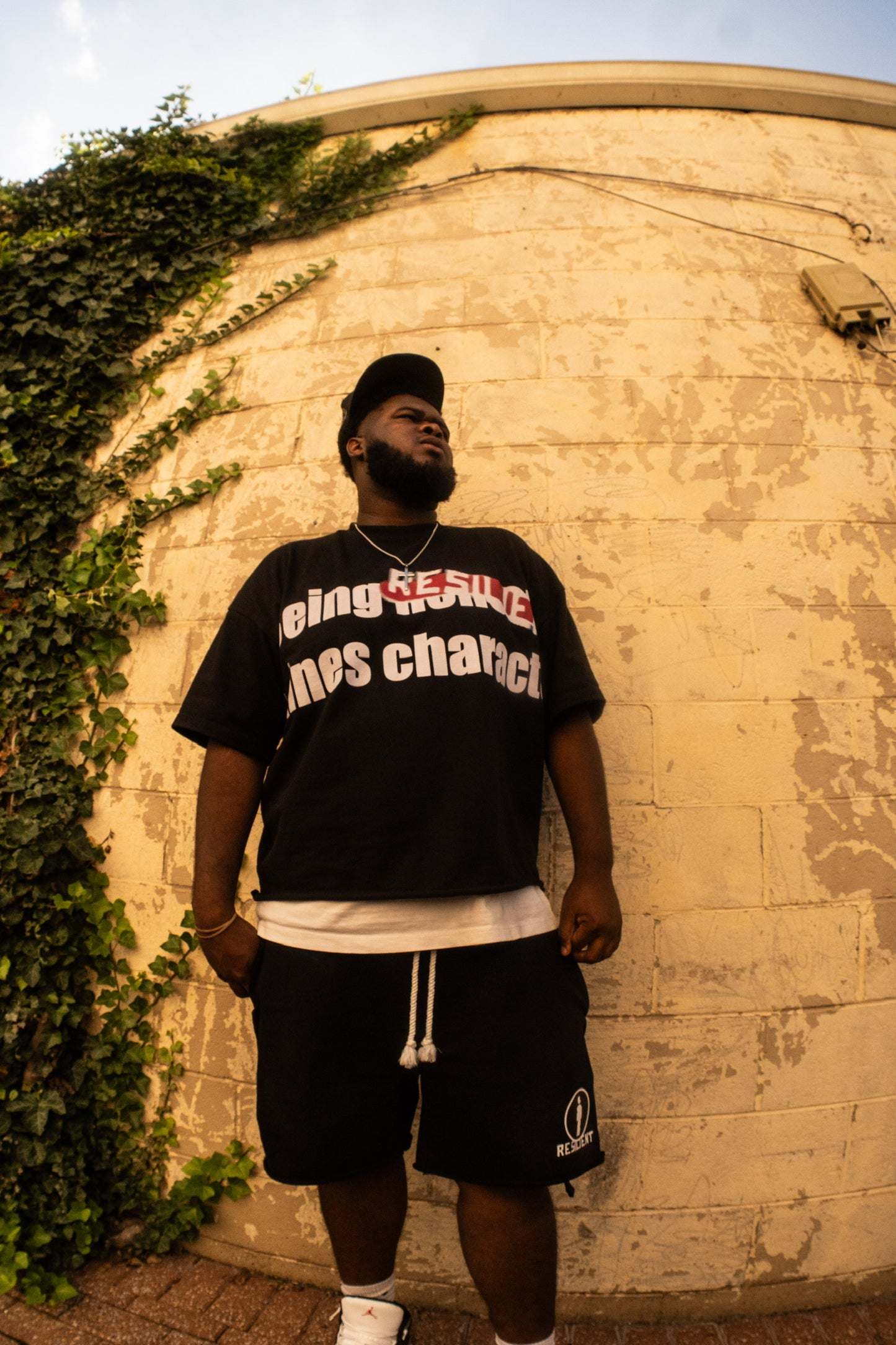 Black "Being Resilient Defines Character" Tee