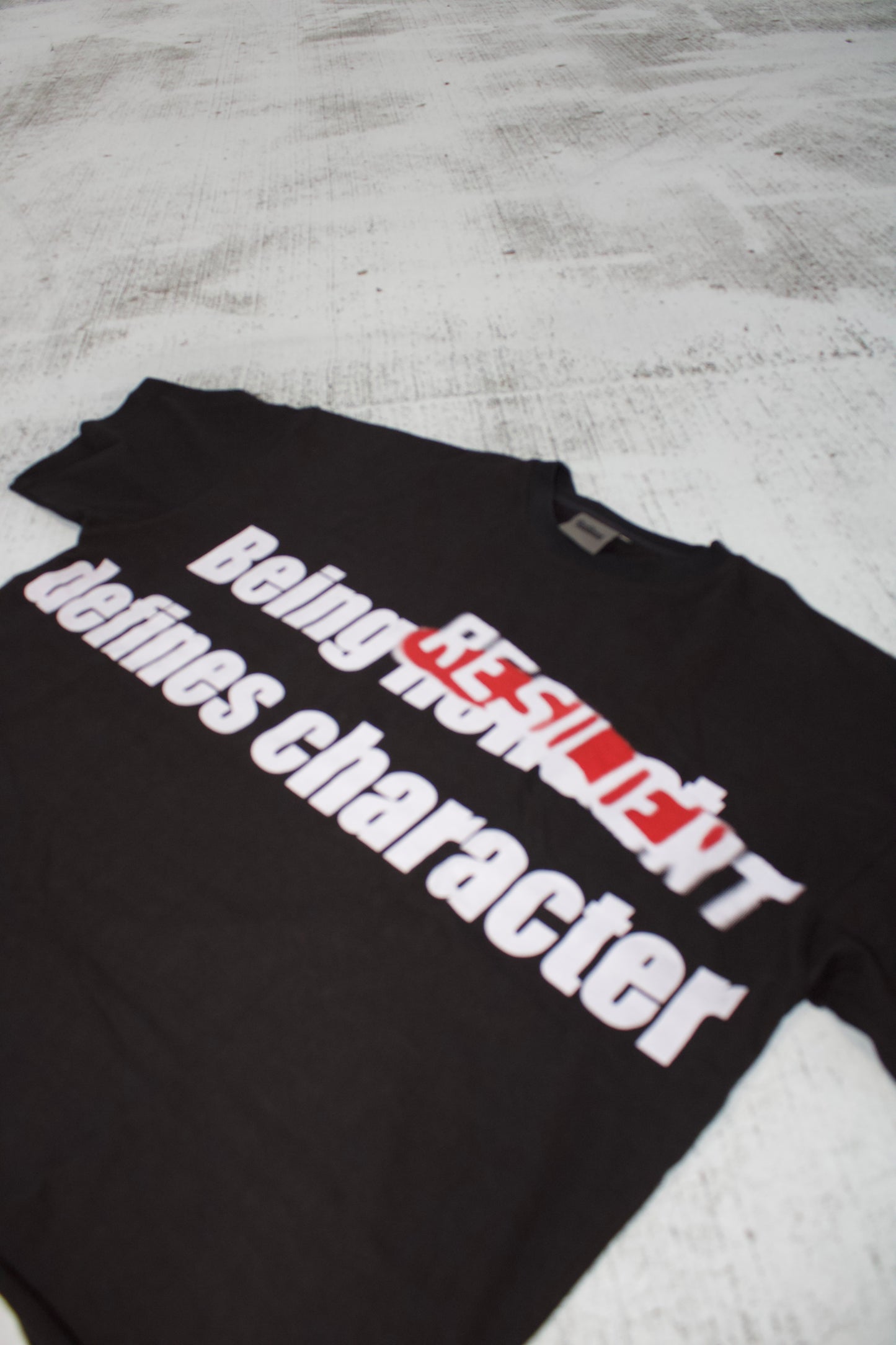 Black "Being Resilient Defines Character" Tee